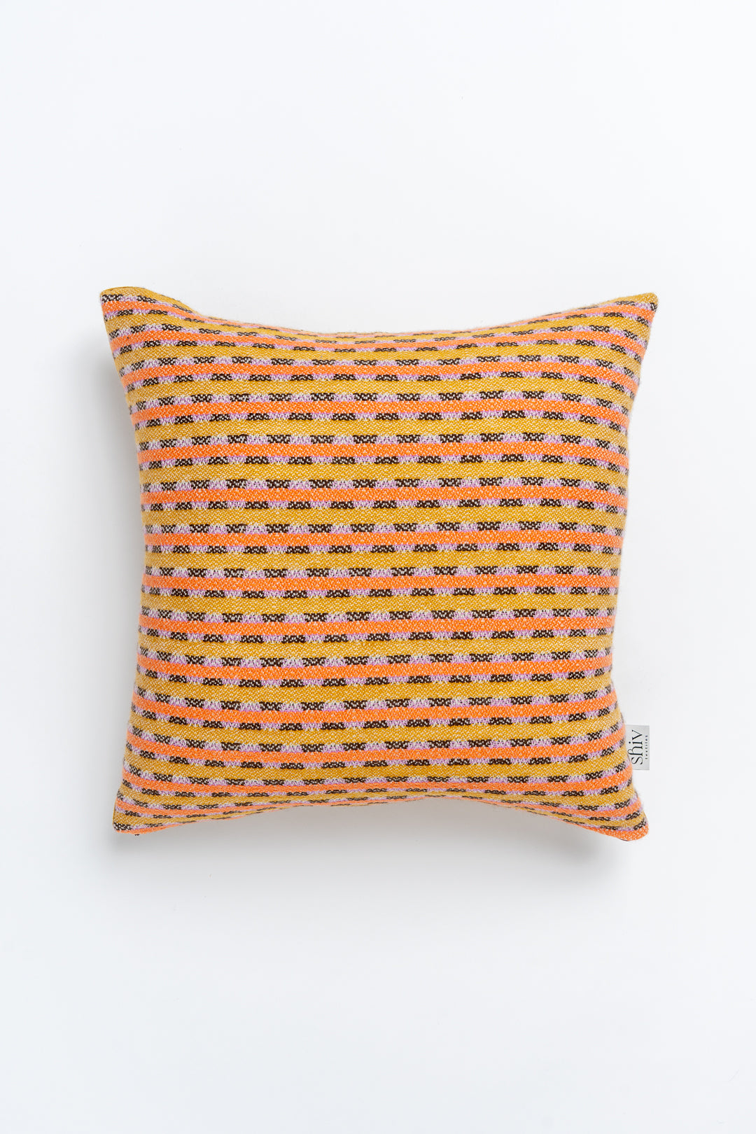 A square-shaped cushion with a geometric pattern in orange and yellow tones, featuring a zipper closure.