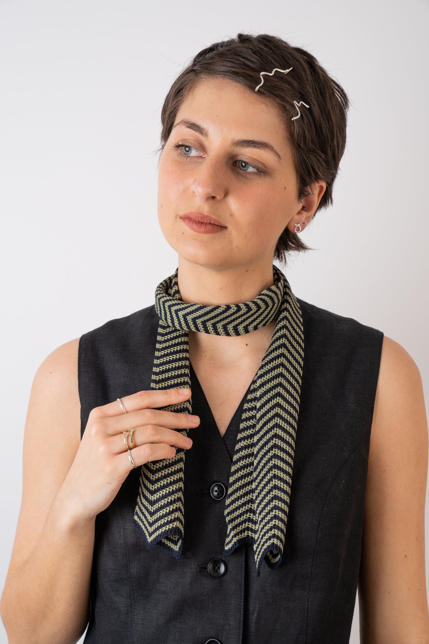 Mussi Knitted Silk Chevron Necktie Large Olive & Navy styled with the Xi Atelier Linen Avery Waistcoat in Black and Folde Jewellery made from recycled silver