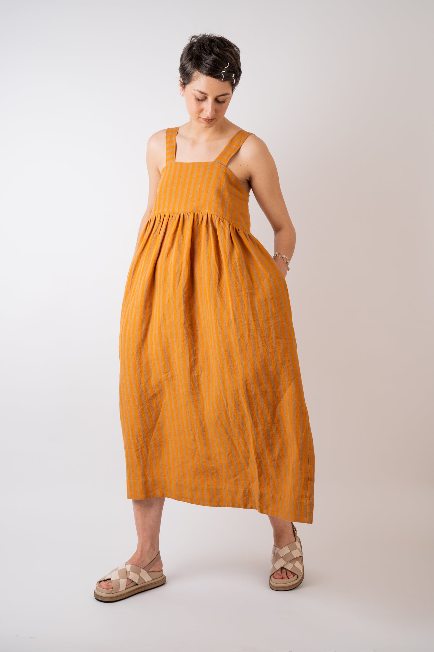 Cawley Studio 100% Irish Stripe Linen Elba Dress in Orange and Terracotta handmade in London with coroza button back fastening detail