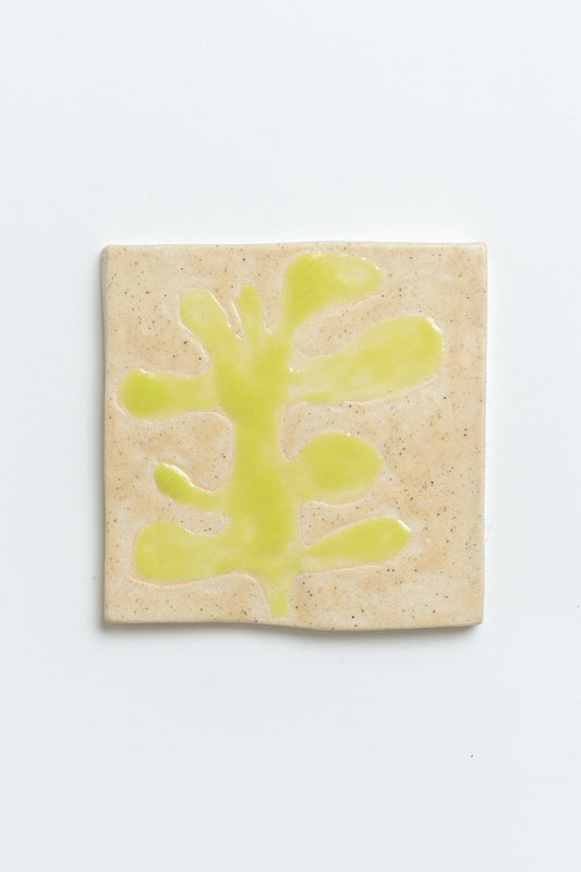 Hand painted ceramic tile with green leaf motif and beige background. MIMMO Studios x Studios Alice Johnson collaboration.