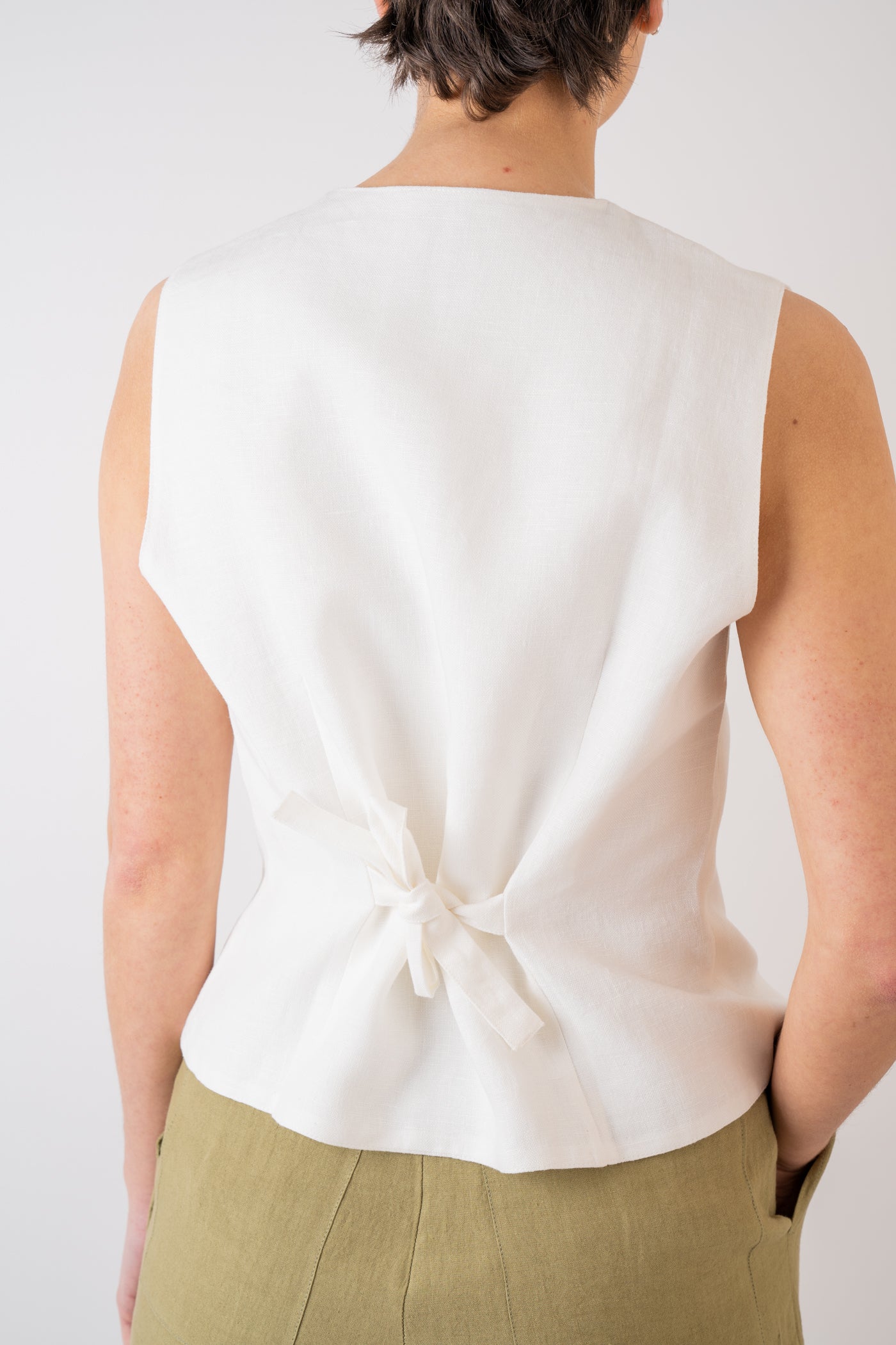 Xi Atelier Linen Avery Waistcoat in white with adjustable tie at the back