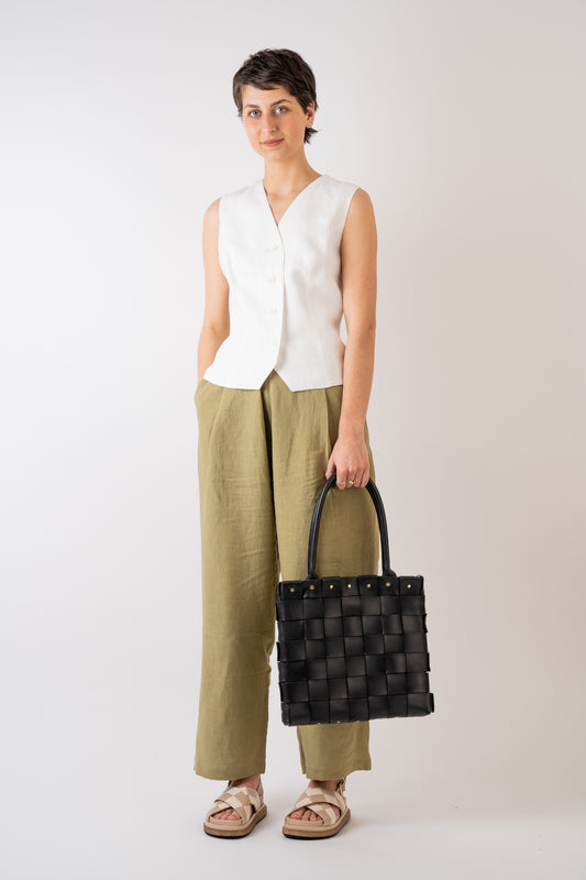 Xi Atelier Linen Avery Waistcoat in white handmade in Glasgow styled with Couper et Coudre Leather Picnic Tote in Noir with brass trim