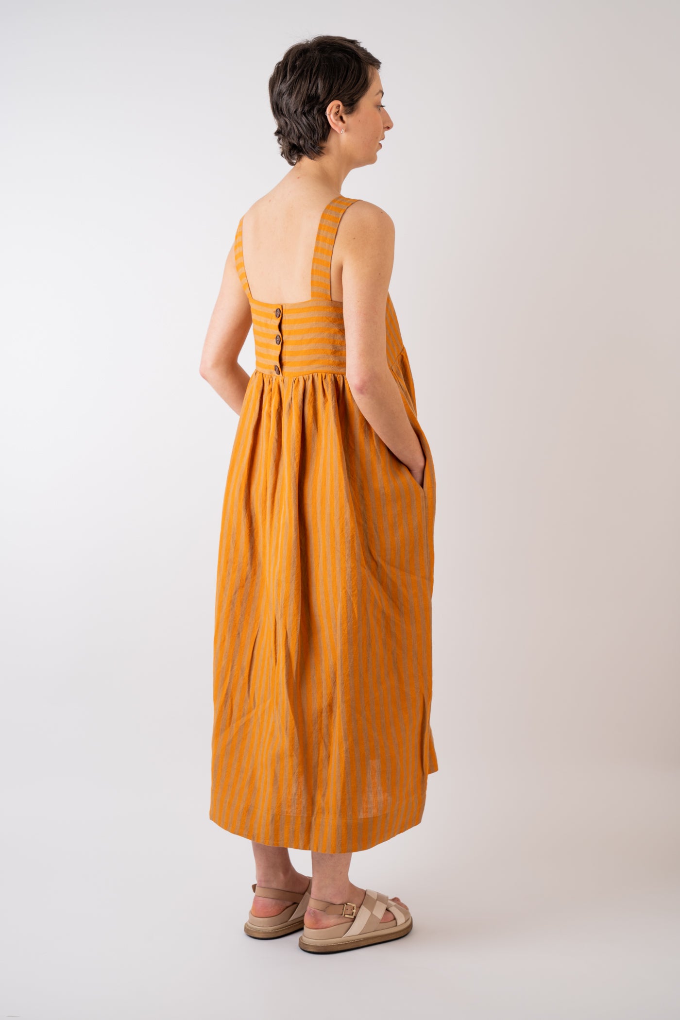 Cawley Studio 100% Irish Stripe Linen Elba Dress in Orange and Terracotta handmade in London with coroza button back fastening detail