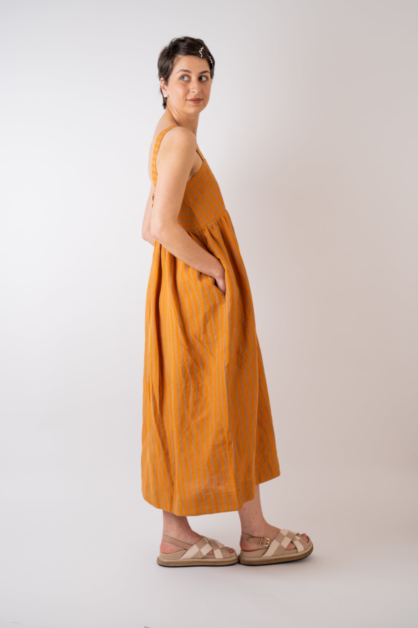 Cawley Studio 100% Irish Stripe Linen Elba Dress in Orange and Terracotta handmade in London with coroza button back fastening detail and side pockets