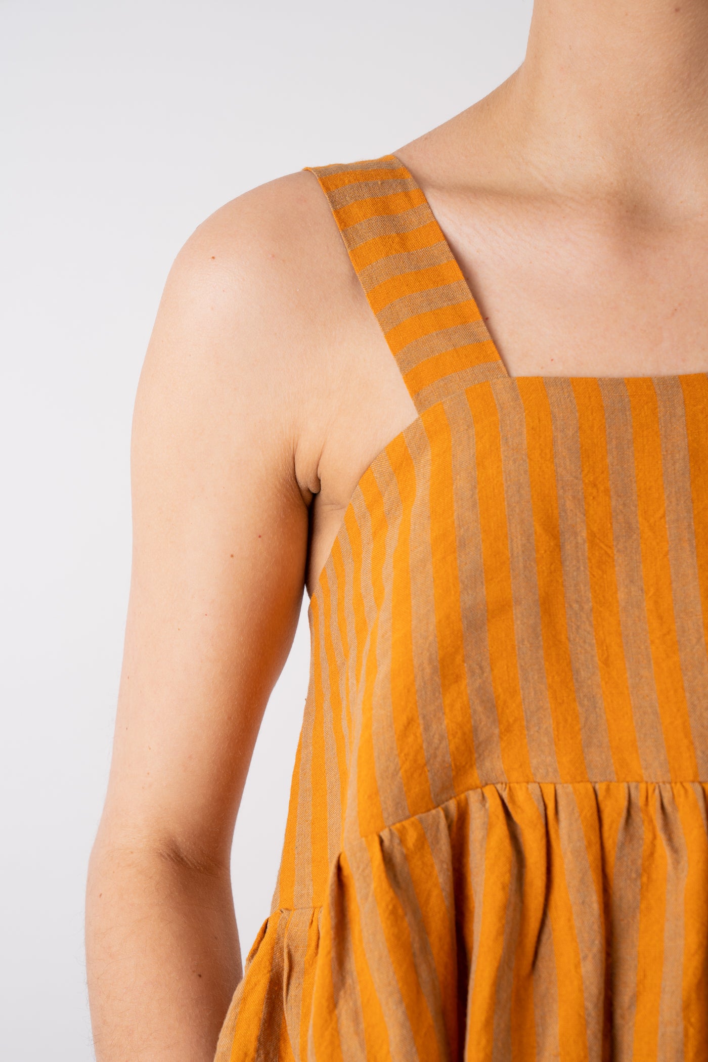 Cawley Studio 100% Irish Stripe Linen Elba Dress in Orange and Terracotta handmade in London shoulder strap detail and gathered front