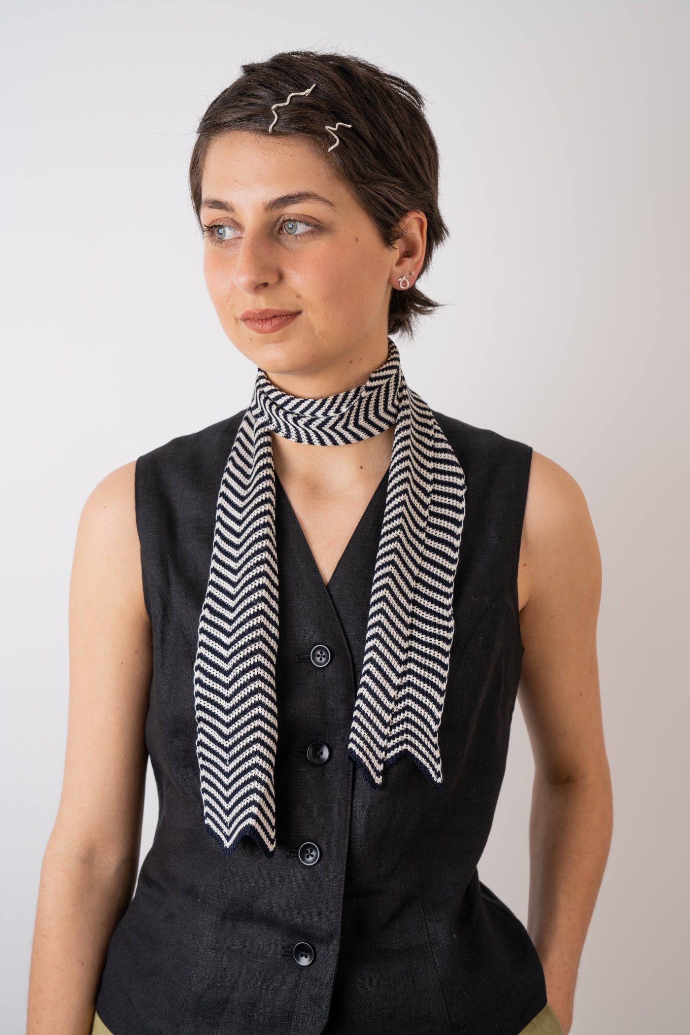 Mussi Knitted Silk Chevron Necktie Large Navy & Ecru styled with the Xi Atelier Linen Avery Waistcoat in Black and Folde Jewellery made from recycled silver