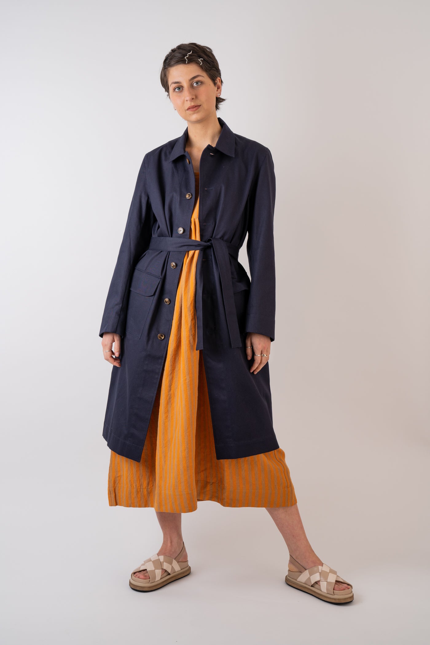 Xi Atelier Organic Cotton Drill Yves Coat in Navy handmade in Glasglow styled with Cawley Studio Elba Linen Stripe Dress