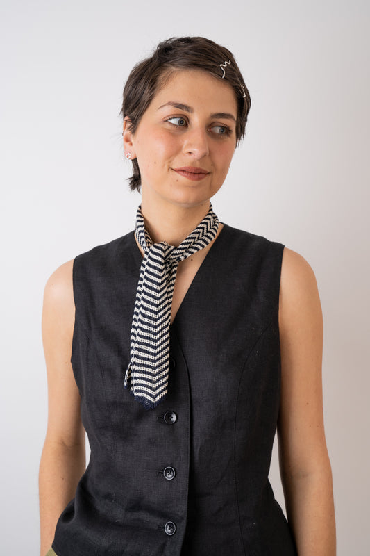 Mussi Knitted Silk Chevron Necktie Small Navy & Ecru styled with the Xi Atelier Linen Avery Waistcoat in Black and Folde Jewellery made from recycled silver